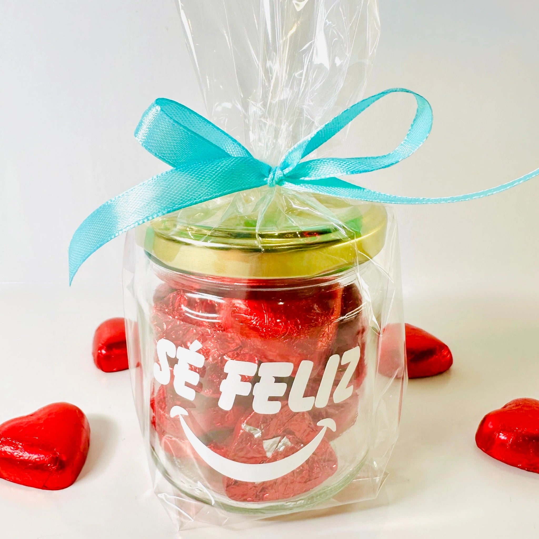 Bote De Corazones De Chocolates Sé Feliz